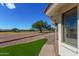 Landscaped backyard with artificial turf and walkway at 2222 S Yellow Wood --, Mesa, AZ 85209