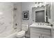 Modern bathroom with marble tile, white vanity, and bathtub at 2222 S Yellow Wood --, Mesa, AZ 85209