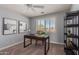 Home office with window shutters, desk, and shelving unit at 2222 S Yellow Wood --, Mesa, AZ 85209