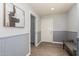 Gray hallway with wainscoting, wood flooring, and linen closet at 2222 S Yellow Wood --, Mesa, AZ 85209