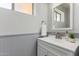 Small bathroom with white vanity and gray wainscoting at 2222 S Yellow Wood --, Mesa, AZ 85209