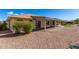Home's backyard with covered patio and gravel at 2222 S Yellow Wood --, Mesa, AZ 85209