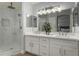 Bathroom with double vanity, large mirror, and walk-in shower at 2222 S Yellow Wood --, Mesa, AZ 85209