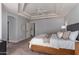 Main bedroom with king-size bed and access to en-suite bathroom at 2222 S Yellow Wood --, Mesa, AZ 85209