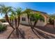 Single-story home with desert landscaping and palm trees at 2222 S Yellow Wood --, Mesa, AZ 85209