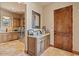 Bright laundry room with cabinets and granite countertop at 9514 E Madera Dr, Scottsdale, AZ 85262