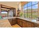 Gourmet kitchen with granite countertops and mountain views at 9514 E Madera Dr, Scottsdale, AZ 85262