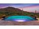 Stunning pool with mountain views at sunset at 9514 E Madera Dr, Scottsdale, AZ 85262