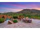 Rustic firepit area with mountain views at 9514 E Madera Dr, Scottsdale, AZ 85262