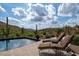 Inviting pool area with mountain views and lounge chairs at 9514 E Madera Dr, Scottsdale, AZ 85262