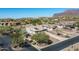 Aerial view of house with gated entry and mountain views at 4126 S Last Chance Trl, Gold Canyon, AZ 85118