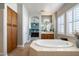 Elegant bathroom with a large soaking tub, double vanity, and ample storage at 4126 S Last Chance Trl, Gold Canyon, AZ 85118