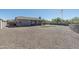 Large gravel backyard with putting green and space for outdoor entertainment at 4126 S Last Chance Trl, Gold Canyon, AZ 85118