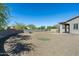 Large backyard with putting green and gravel landscaping at 4126 S Last Chance Trl, Gold Canyon, AZ 85118