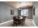 Formal dining room with dark wood table and six chairs at 4126 S Last Chance Trl, Gold Canyon, AZ 85118