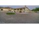 Backyard features a putting green, patio, and gravel landscaping at 4126 S Last Chance Trl, Gold Canyon, AZ 85118