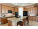 Spacious kitchen with island, granite countertops, and stainless steel appliances at 4126 S Last Chance Trl, Gold Canyon, AZ 85118