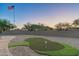 Putting green in a backyard with mountain views at 4126 S Last Chance Trl, Gold Canyon, AZ 85118