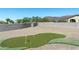 Landscaped backyard with putting green and mountain views at 4126 S Last Chance Trl, Gold Canyon, AZ 85118
