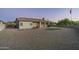House backyard with putting green, gravel, and mountain views at 4126 S Last Chance Trl, Gold Canyon, AZ 85118