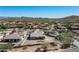 Aerial view of house and community, showcasing surrounding mountain views at 4126 S Last Chance Trl, Gold Canyon, AZ 85118