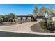 House exterior with a paved driveway and desert landscaping at 4126 S Last Chance Trl, Gold Canyon, AZ 85118