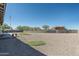 Landscaped backyard with putting green and gravel at 4126 S Last Chance Trl, Gold Canyon, AZ 85118