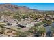 Aerial view of a house with a mountain backdrop at 4126 S Last Chance Trl, Gold Canyon, AZ 85118