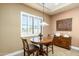 Charming breakfast nook with wood table and chairs, near kitchen at 4126 S Last Chance Trl, Gold Canyon, AZ 85118