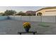 Backyard features a putting green, gravel landscaping, and a small bench at 4126 S Last Chance Trl, Gold Canyon, AZ 85118