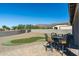 Spacious backyard with putting green, gravel, and mountain backdrop at 4126 S Last Chance Trl, Gold Canyon, AZ 85118