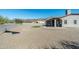 Backyard features a putting green, patio, and gravel landscaping at 4126 S Last Chance Trl, Gold Canyon, AZ 85118