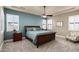 Bright bedroom with wood furniture, ceiling fan, and neutral carpet at 4126 S Last Chance Trl, Gold Canyon, AZ 85118