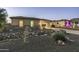 House exterior at dusk, with landscaping and a paved driveway at 4126 S Last Chance Trl, Gold Canyon, AZ 85118