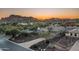 Aerial view of house at sunset, showcasing the landscaping and surroundings at 4126 S Last Chance Trl, Gold Canyon, AZ 85118