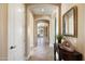 Bright entry hallway with tile flooring and a decorative console table at 4126 S Last Chance Trl, Gold Canyon, AZ 85118