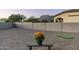 Backyard features a putting green, gravel landscaping, and a small bench at 4126 S Last Chance Trl, Gold Canyon, AZ 85118