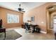 Home office with wood desk, chair, and plenty of natural light at 4126 S Last Chance Trl, Gold Canyon, AZ 85118