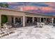 Spacious patio with seating area, overlooking a tranquil lake at 24426 S Ribbonwood Dr, Sun Lakes, AZ 85248