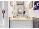 Clean and nicely appointed half bathroom with vanity at 24426 S Ribbonwood Dr, Sun Lakes, AZ 85248