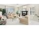 Bright living room with a fireplace, and comfortable seating at 24426 S Ribbonwood Dr, Sun Lakes, AZ 85248