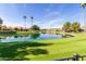 Stunning lake view from the backyard of the house at 24426 S Ribbonwood Dr, Sun Lakes, AZ 85248