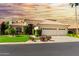 Beautiful two-story home with a three-car garage and manicured lawn at 24426 S Ribbonwood Dr, Sun Lakes, AZ 85248