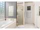 Spa-like bathroom with shower, bathtub and black and white striped walls at 24426 S Ribbonwood Dr, Sun Lakes, AZ 85248