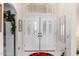 Bright entryway with double doors and a decorative stained glass window at 24426 S Ribbonwood Dr, Sun Lakes, AZ 85248