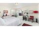 Guest bedroom with a comfortable bed, desk, and built-in shelving at 24426 S Ribbonwood Dr, Sun Lakes, AZ 85248