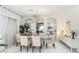 Elegant dining room with a glass table and crystal chandelier at 24426 S Ribbonwood Dr, Sun Lakes, AZ 85248