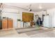 Spacious garage with extra storage and work area at 24426 S Ribbonwood Dr, Sun Lakes, AZ 85248