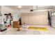 Organized garage with storage cabinets and flooring at 24426 S Ribbonwood Dr, Sun Lakes, AZ 85248