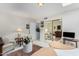 Spacious bedroom with mirrored closet doors and seating area at 24426 S Ribbonwood Dr, Sun Lakes, AZ 85248